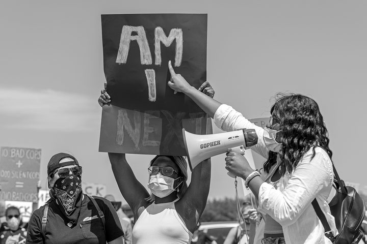"Am I Next?", Young Black activists address a predominantly white audience at the airfield in Bangor, Maine, where Air Force One carrying President Trump landed moments earlier, photo: Young Sun Han